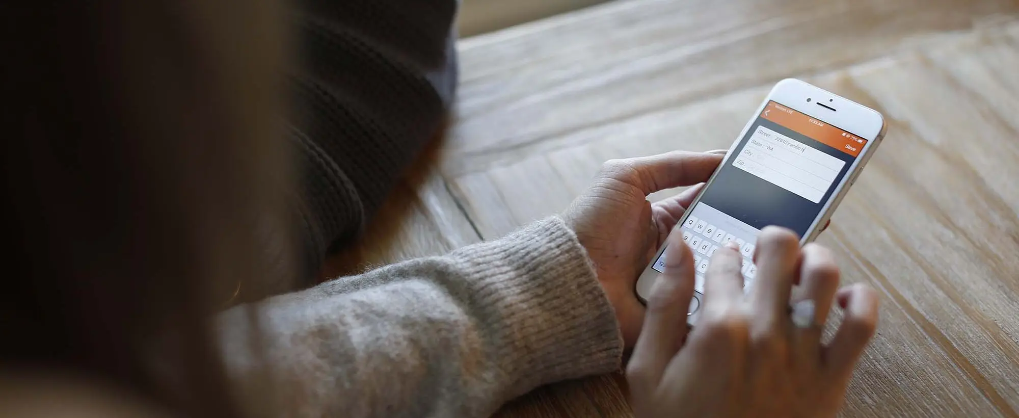 A customer easily booking an affordable junk removal service in King County on their phone using M&M Junk Removal's convenient online scheduling tool.